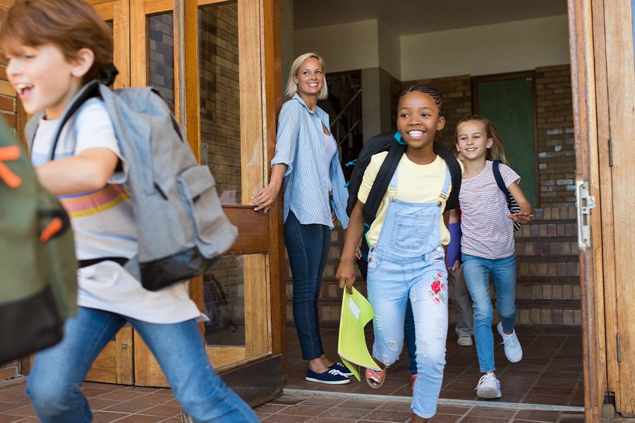 OSBA Wellness Program - Children Running Outside of Classroom at the End of a School Day